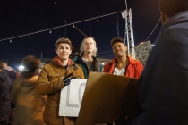 Richard Elliot (right) passed out refreshments to protesters in the Inner Harbor. 